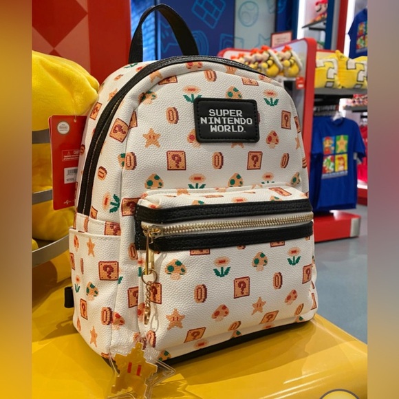Nintendo Handbags - Universal Studios Hollywood Super Nintendo World 8 Bit Mini Backpack NWT​